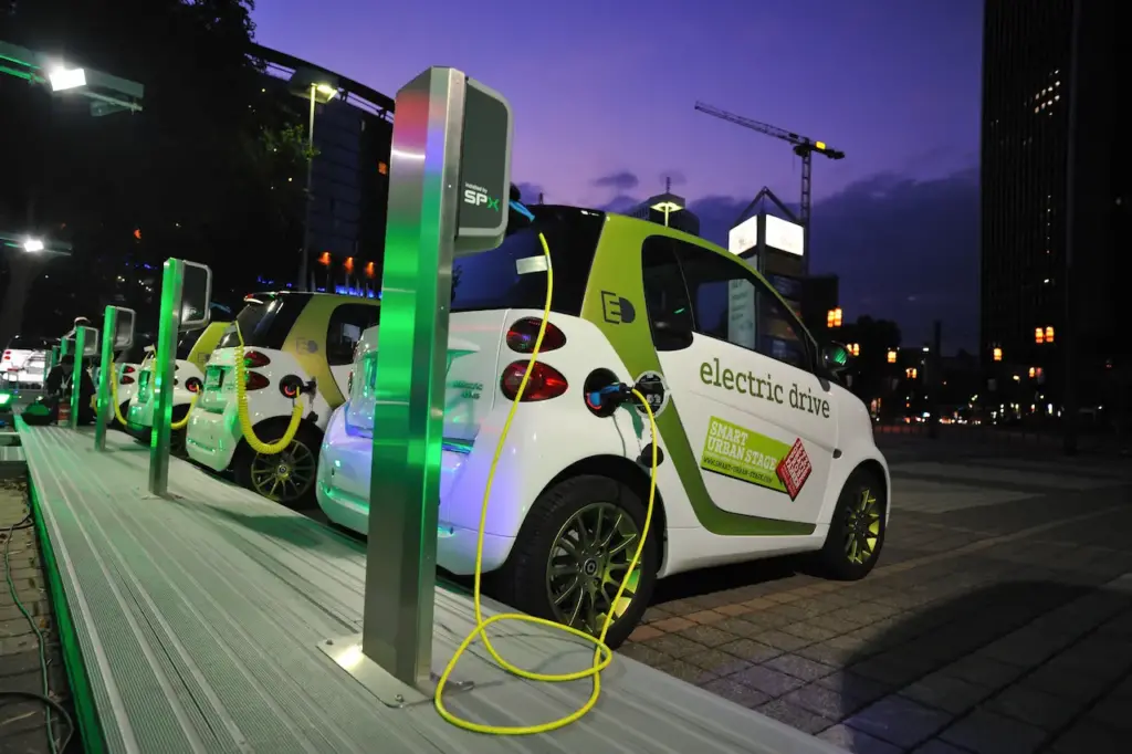 Electric Cars Being Charged At A Charging Station